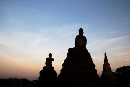 Stone statue of Buddha at twilight time Wat Chaiwatthanaram Temple of Ayuthaya Province ( Ayutthaya Historical Park ) Thailandの写真素材