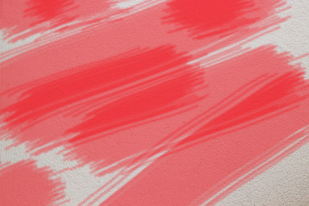 Red painted cement wall texture/backgroundの写真素材
