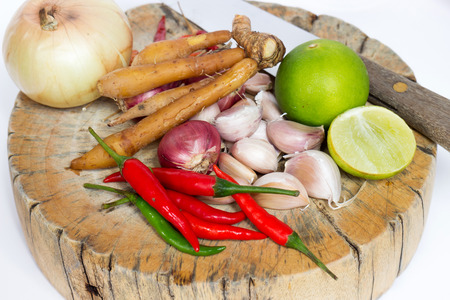 Herbs and spices set on the chopping block with knife to make spicy soup and fried delicious recipes, spicy ingredient in Thailandの写真素材
