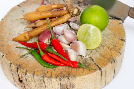 Herbs and spices set on the chopping block with knife to make spicy soup and fried delicious recipes, spicy ingredient in Thailandの写真素材