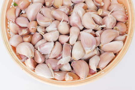 Basket of fresh garlic cloveの写真素材