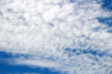 Altocumulus clouds on blue sky の写真素材