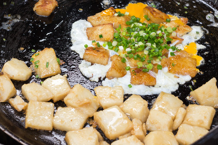 'Bot Chien' Fried rice flour cake with eggs, Vietnamese street food in Ho Chi Minh city.の写真素材