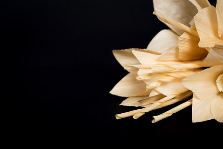 Kind of wood flower isolated on black background; to be placed on the site of cremation in Thailand. (Dok Mai Jan)の写真素材