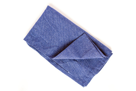 Soft fluffy blue hand towel isolated on white backgroundの写真素材