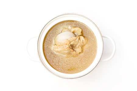 Pot of pork bone soup isolated on white backgroundの写真素材