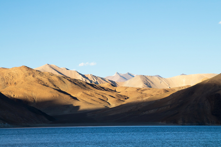 Pangong Tso is an endorheic lake in the Himalayas situated at a height of about 4,350 m. It is 134 km long and extends from India to Tibet in Ladakh, Indiaの写真素材