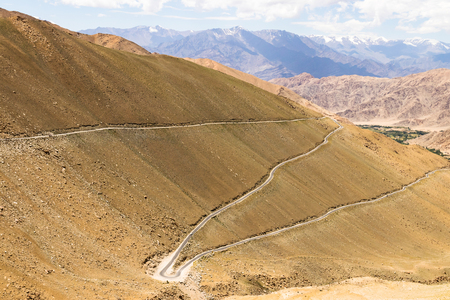 Mountain road in Ladakh Highway, Jammu and Kashmir, India. Ladakh is a mountainous region in northwest India and in the area known as the Trans-Himalaya.の写真素材