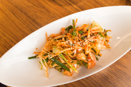 Kimchi made with bunching onion and bean sprouts, is a traditional fermented Korean side dish made of vegetables with a variety of seasonings (Pa Kimchi)の写真素材