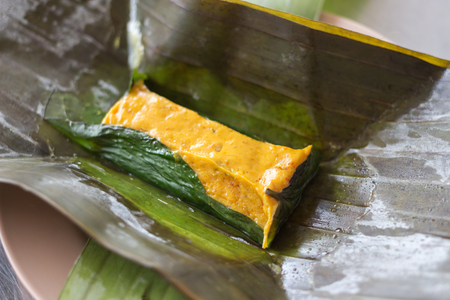 Steamed fish, shrimps or squid with curry paste mixed coconut milk; Thai traditional spicy food.の写真素材