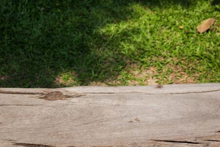 Wooden terrace with green grass field beautiful nature background