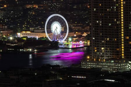 Ferris wheel at Asiatique, open community shopping mall riverfront at Chao Phraya river in Bangkok, Thailand.の写真素材
