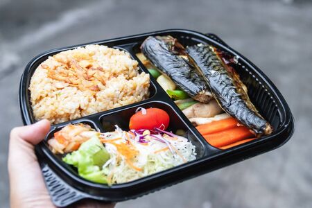 Take away a bento box of grilled Saba fish, grilled vegetables, salad, garlic fried rice and kimchi...