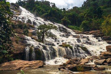 Mae Ya waterfall at Doi Inthanon national park, Chiang mai ,Thailand : conveying smooth flowing motion. Conceptual and useful for backgroundの写真素材