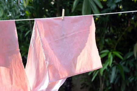 Wooden clothespins with traditional thai pattern of natural dyes extracting dyes from plant in the...