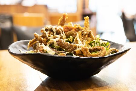 Fresh salad with crispy skin salmon on top.の写真素材