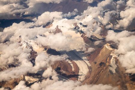 Beautiful sandstone Himalayan mountains with snow. View from the airplane of Leh - Ladakh, Northern...