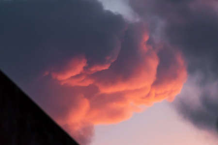 Sunset sky with amazing clouds shades of the red, natural background.