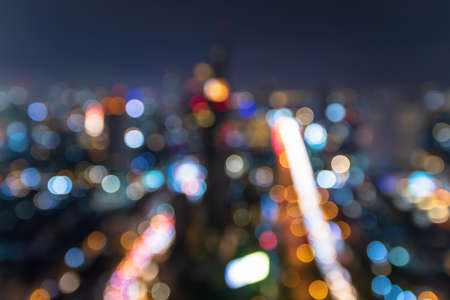 Blurred image for background of modern business city with bokeh and colorful lights of traffic in the city.の写真素材