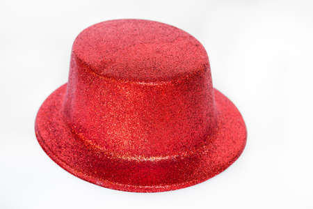 Red glitter party hat isolated on a white background.の写真素材