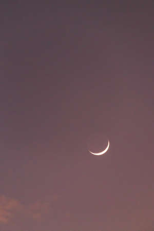 Earthshine is a soft, faint glow on the dark side of the moon. Earthshine occurs when sunlight reflects off the Earth's surface and illuminates the unlit portion of the Moon's surface.の写真素材