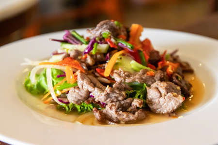 Spicy salad of grilled beef with herb.の写真素材