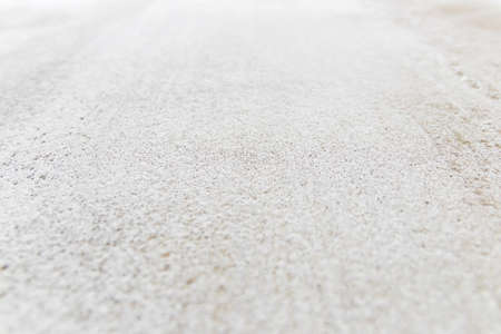 White painted cement wall texture and background. Selective focus.