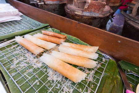 Traditional Phuket snack that is not to be missed is A-pong. Crepe is crispy on the outside and soft on the inside. Made from a rice flour, coconut milk and sugar. Popular street stall in Phuket town.の写真素材