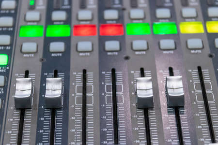 Audio sound mixer controller at studio. Professional sound mixer closeup.