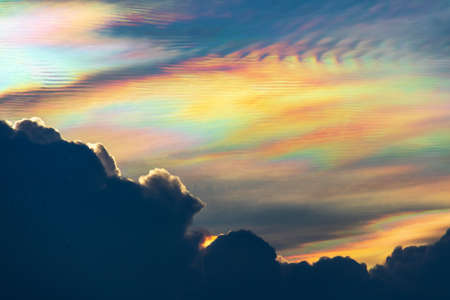 Beautiful iridescent cloud, Irisation. Skyscraper background.の写真素材