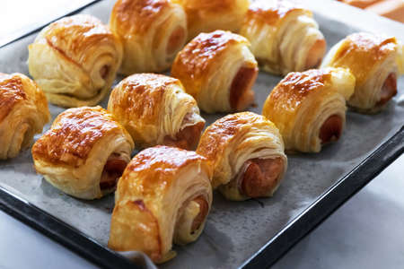 Homemade mini sausage puff pastry just out of the oven.の写真素材
