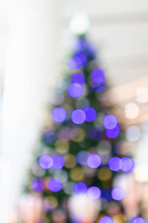 Blurred image for background of light decorated on christmas tree.の写真素材