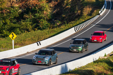Nan,Thailand - December, 2021: Supercar on road No. 3 (root 1081) over top of mountains in Santisuk - Bo Kluea District. Beautiful landscape scenic of road number three at Nan, Thailand.のeditorial素材