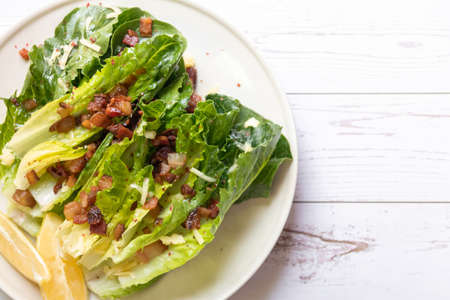 Cos lettuce salad with crispy bacon, and parmesan cheese. Easy healthy recipes.の写真素材