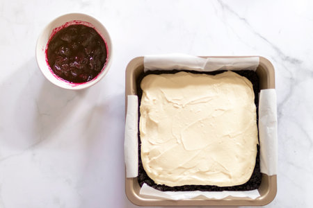 Homemade creamy cheese pie with juicy blueberry sauce and fresh blueberries.の写真素材