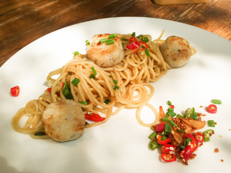 Spaghetti scallops with fresh chili and himalayan salt.の写真素材