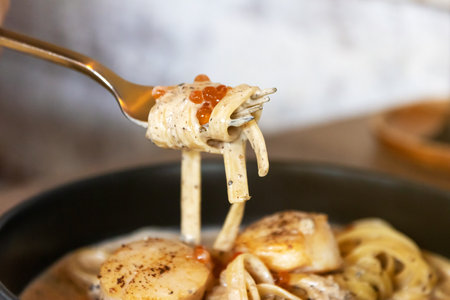 Fork of fettuccine with truffle cream sauce.の写真素材
