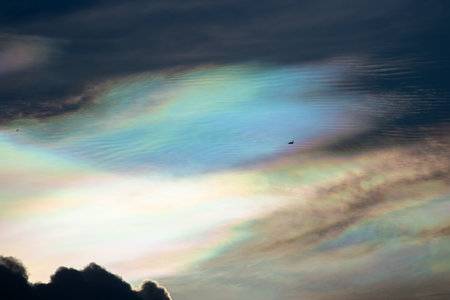 Beautiful iridescent cloud, Irisation. Skyscraper background.の写真素材