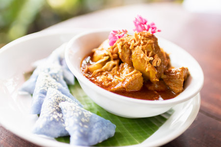 'Hung Lay' curry with pork served with steamed glutinous rice. This curry from northern Thailand is like no other. Slow-simmered, slightly sweet and tangy, and full of rich, compleの写真素材