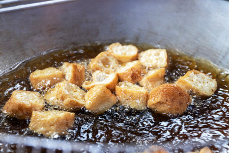 Vendor selling deep fried tofu, taro, radish and corn usually serving with peanut sweet and sour dipping sauce.の写真素材