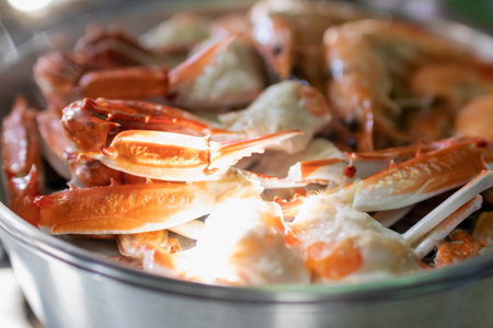 Steam blue crab legs and shrimp on food steamer.の写真素材