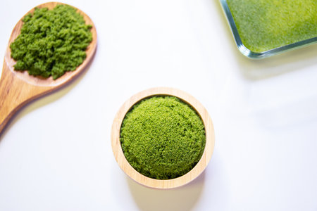 Wolffia globosa in wooden bowl. Wolffia is the nutrient-rich plant-based source of protein and...