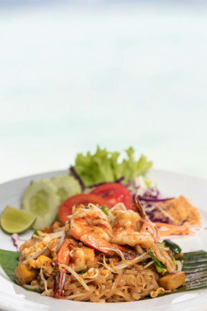 Pad Thai (Stir-fried rice noodles with shrimp) flavor with sugar, lime, ground dried chilies and peanuts; Thailand's popular dishes.の写真素材