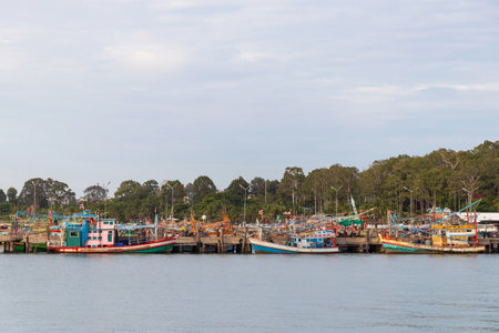 Fishing boat floating on the sea at pier.