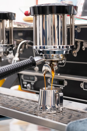 Close-up of espresso extraction process from a coffee machine, capturing the rich flow of coffee...