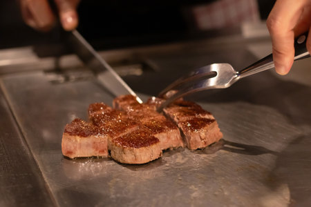 Chef cooking a delicious steak on the grill.の写真素材
