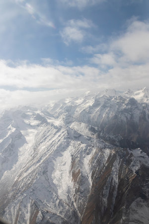 Mountains views from airplane (Islamabad to Skardu) in Pakistan. Beautiful view of snow capped mountainsの写真素材