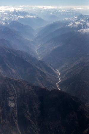 Mountains views from airplane (Islamabad to Skardu) in Pakistan. Beautiful view of snow capped mountainsの写真素材