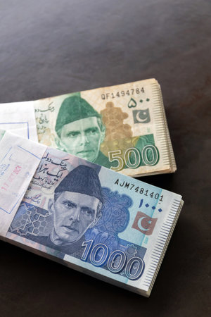 Pakistani currency note closely on wooden background.の写真素材