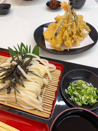 Delicious Japanese noodles and tempura dish.の写真素材